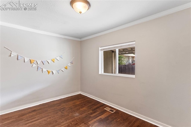 121 Via, San Miguel, Manitou Springs, CO 80829 - unfurnished room with crown molding and dark wood finished floors
