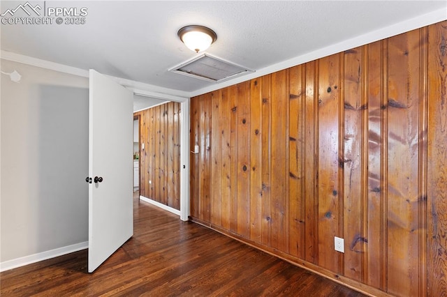 121 Via, San Miguel, Manitou Springs, CO 80829 - unfurnished room featuring wood finished floors, attic access, and wooden walls