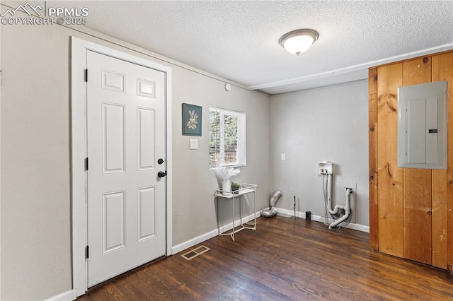 121 Via, San Miguel, Manitou Springs, CO 80829 - foyer entrance featuring electric panel, a textured ceiling, and wood finished floors