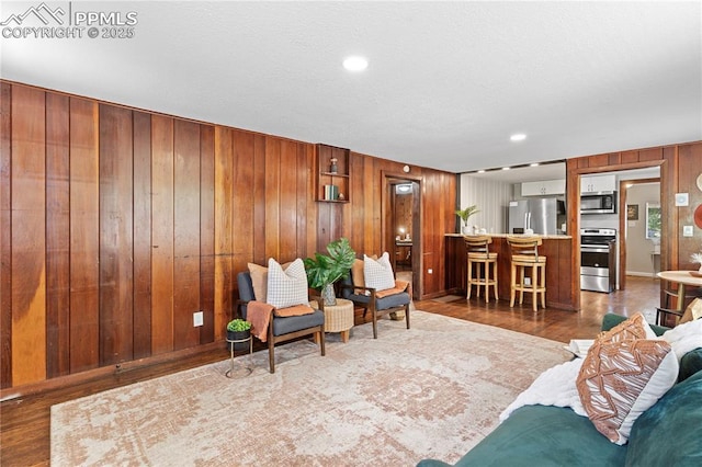 121 Via, San Miguel, Manitou Springs, CO 80829 - living room with wooden walls and wood finished floors