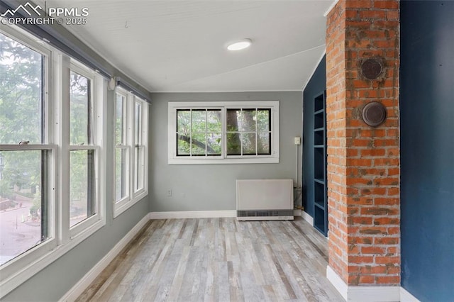 33 Minnehaha Ave, Manitou Springs, CO 80829 - unfurnished sunroom featuring wood finished floors and radiator