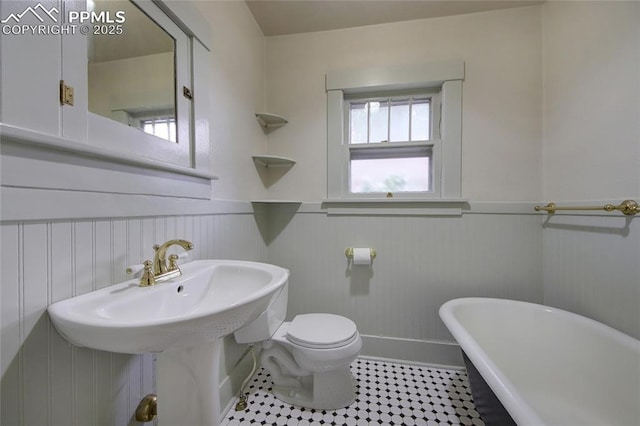 620 E Fontanero St, Colorado Springs, CO 80907 - full bathroom with a freestanding bath, wainscoting, and tile patterned floors