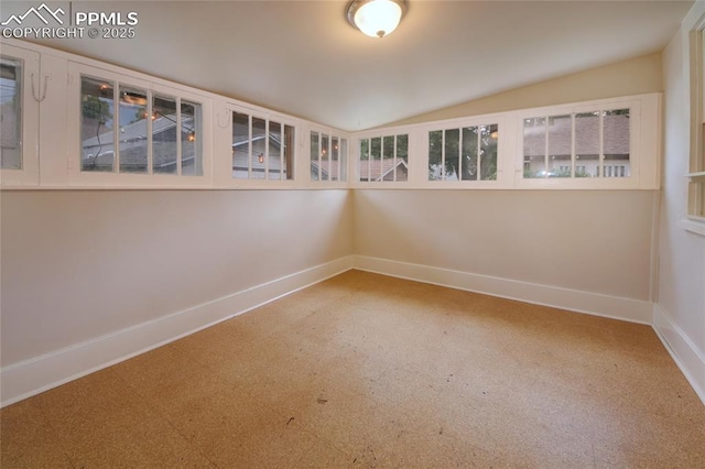620 E Fontanero St, Colorado Springs, CO 80907 - carpeted empty room featuring baseboards and vaulted ceiling