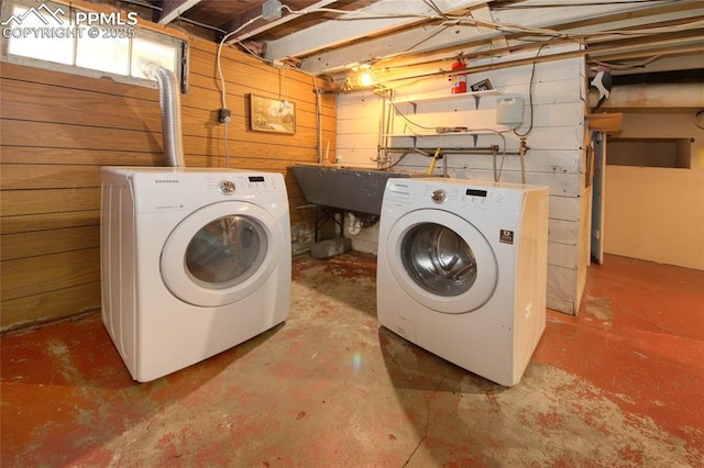 620 E Fontanero St, Colorado Springs, CO 80907 - laundry area with washer and dryer and wood walls