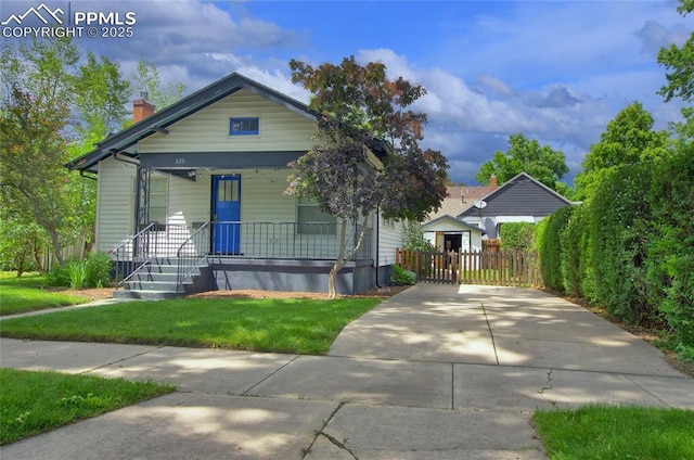 620 E Fontanero St, Colorado Springs, CO 80907 - view of front of house with a chimney and covered porch
