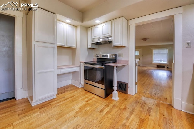 620 E Fontanero St, Colorado Springs, CO 80907 - kitchen with electric range, under cabinet range hood, light wood-style floors, white cabinets, and recessed lighting
