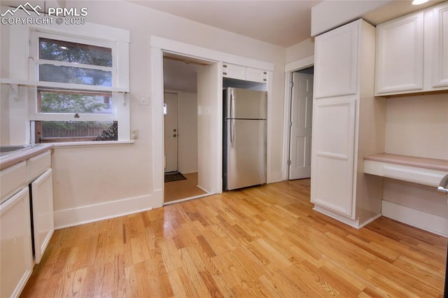 620 E Fontanero St, Colorado Springs, CO 80907 - unfurnished bedroom featuring freestanding refrigerator and light wood-type flooring