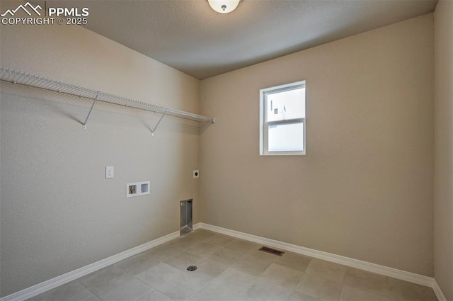 8235 Kittrick Pl, Falcon, CO 80831 - laundry room with electric dryer hookup, hookup for a washing machine, and light tile patterned flooring