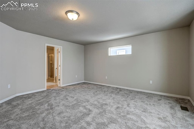 8235 Kittrick Pl, Falcon, CO 80831 - carpeted spare room featuring baseboards and a textured ceiling