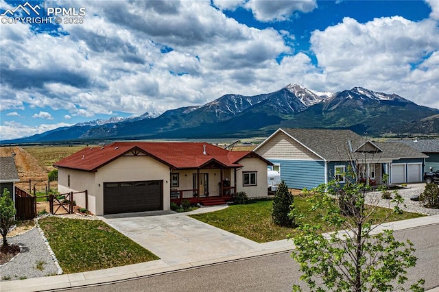 106 Red Tail Blvd, Buena Vista, CO 81211 - ranch-style home with a mountain view, a garage, concrete driveway, and stucco siding