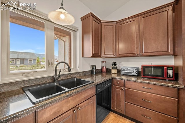 106 Red Tail Blvd, Buena Vista, CO 81211 - kitchen with black dishwasher, dark countertops, decorative light fixtures, light wood-type flooring, and brown cabinetry