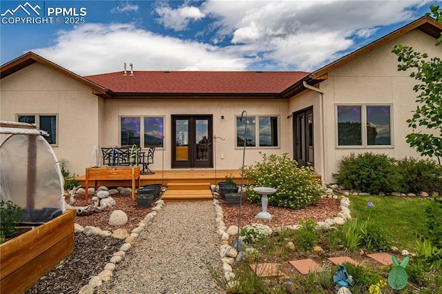 106 Red Tail Blvd, Buena Vista, CO 81211 - view of front of home with french doors, stucco siding, and roof with shingles