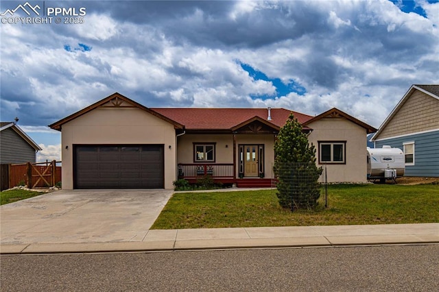 106 Red Tail Blvd, Buena Vista, CO 81211 - ranch-style home featuring stucco siding, a garage, driveway, and covered porch