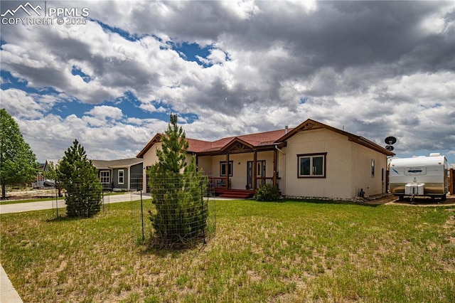 106 Red Tail Blvd, Buena Vista, CO 81211 - single story home featuring a front lawn, a porch, driveway, and stucco siding