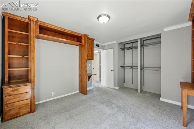 1137 Pando Ave, Colorado Springs, CO 80905 - unfurnished bedroom with a closet, carpet floors, and ornamental molding