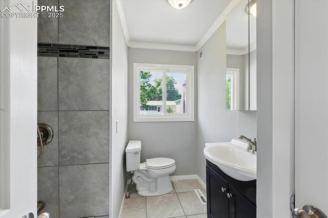 1137 Pando Ave, Colorado Springs, CO 80905 - full bathroom with vanity, crown molding, tiled shower, and tile patterned floors