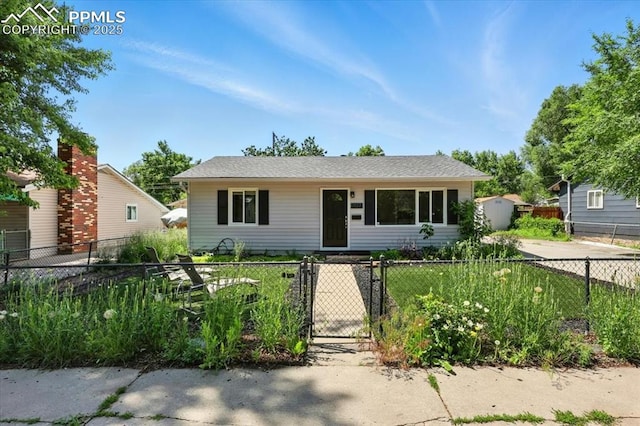 1137 Pando Ave, Colorado Springs, CO 80905 - view of front facade with a gate and a storage shed