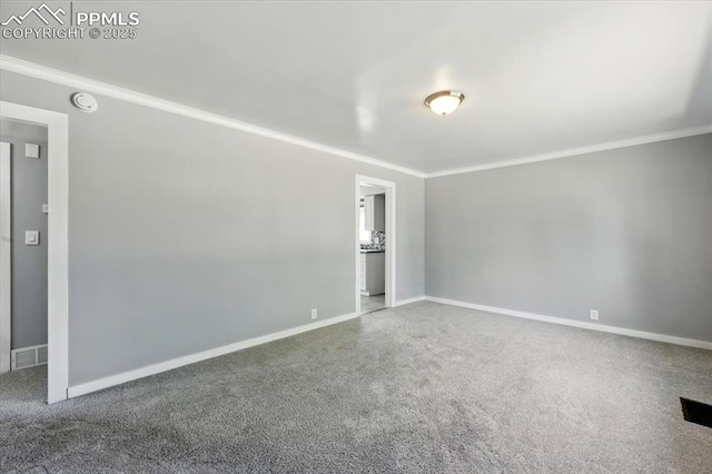 1137 Pando Ave, Colorado Springs, CO 80905 - unfurnished room featuring crown molding, a smoke detector, and carpet