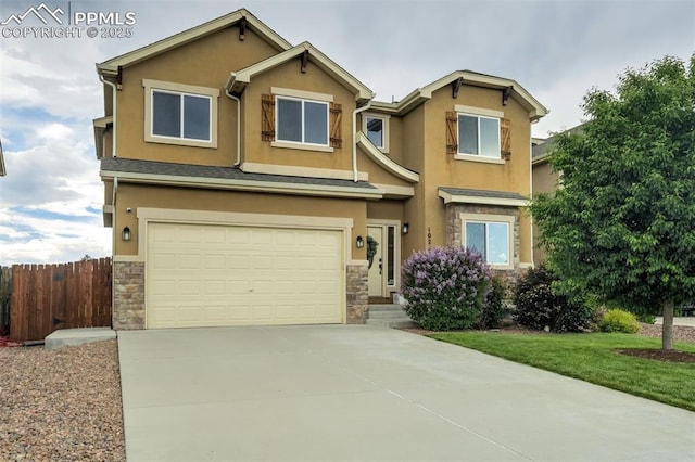10280 Abrams Dr, Colorado Springs, CO 80925 - view of front of home featuring stone siding, stucco siding, a garage, and driveway