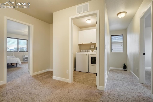 10280 Abrams Dr, Colorado Springs, CO 80925 - laundry room with separate washer and dryer, light colored carpet, and cabinet space
