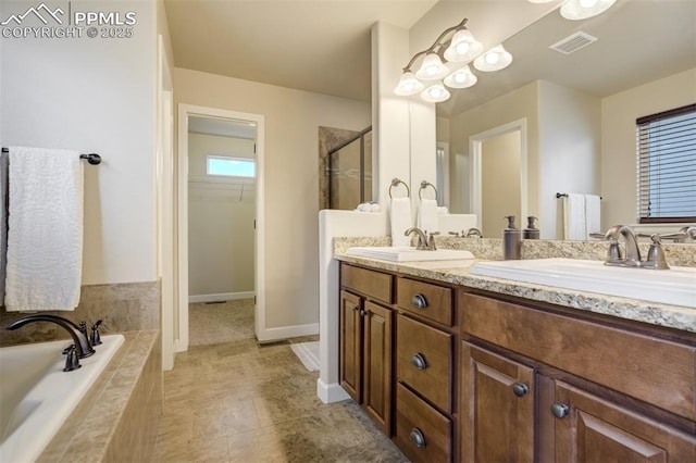 10280 Abrams Dr, Colorado Springs, CO 80925 - full bath featuring a stall shower, double vanity, a garden tub, and a walk in closet