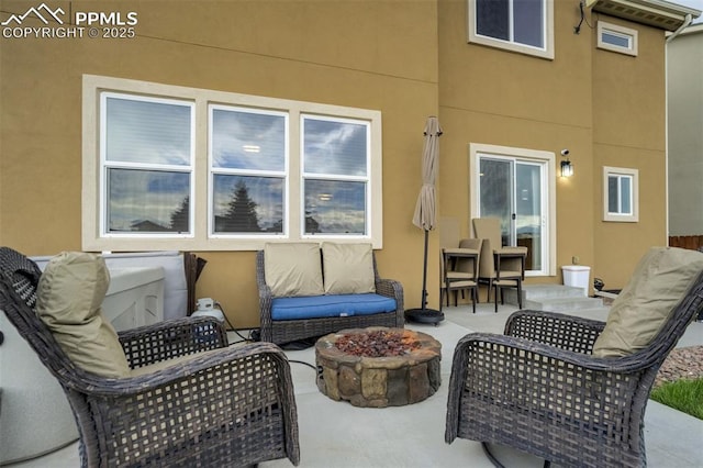 10280 Abrams Dr, Colorado Springs, CO 80925 - view of patio / terrace with a fire pit