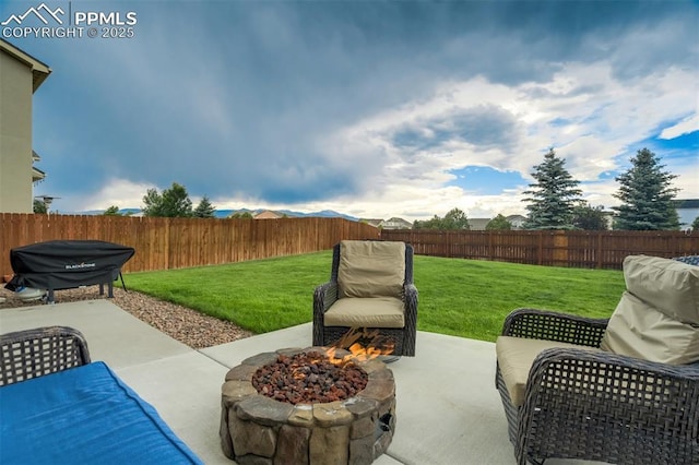 10280 Abrams Dr, Colorado Springs, CO 80925 - fenced backyard featuring a patio area and an outdoor fire pit