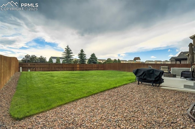 10280 Abrams Dr, Colorado Springs, CO 80925 - fenced backyard featuring a patio area
