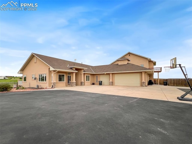 7416 Crow Ct, Colorado Springs, CO 80908 - view of front facade featuring a garage, stucco siding, and concrete driveway