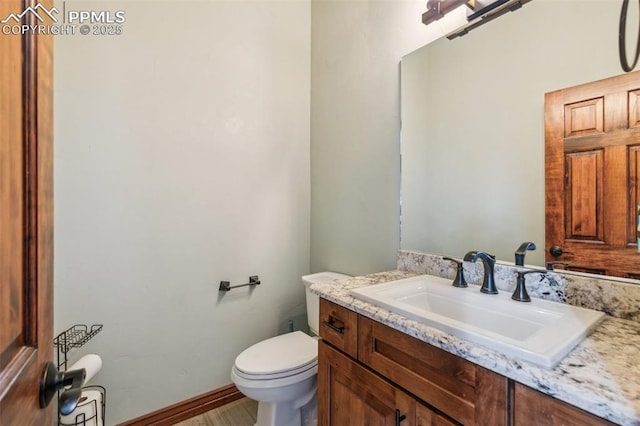 7416 Crow Ct, Colorado Springs, CO 80908 - half bathroom featuring vanity and toilet