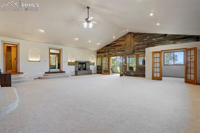 2550 Slocum Rd, Peyton, CO 80831 - unfurnished living room featuring high vaulted ceiling, ceiling fan, carpet floors, a fireplace, and recessed lighting