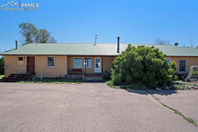 2550 Slocum Rd, Peyton, CO 80831 - view of front of property featuring stucco siding and a metal roof