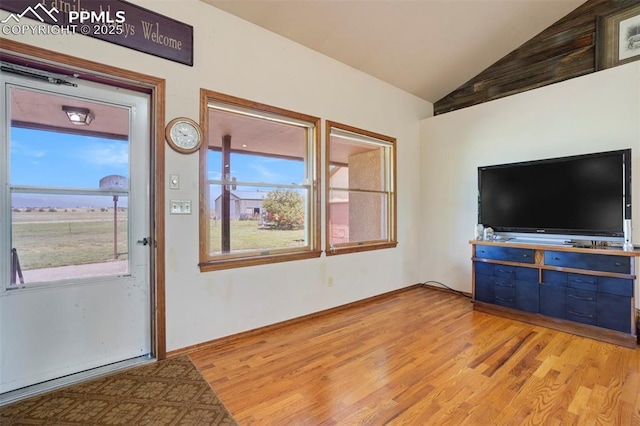 2550 Slocum Rd, Peyton, CO 80831 - unfurnished living room featuring plenty of natural light, light wood-style floors, and high vaulted ceiling