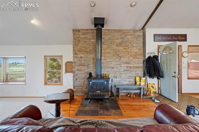 2550 Slocum Rd, Peyton, CO 80831 - living area featuring a wood stove and wood finished floors