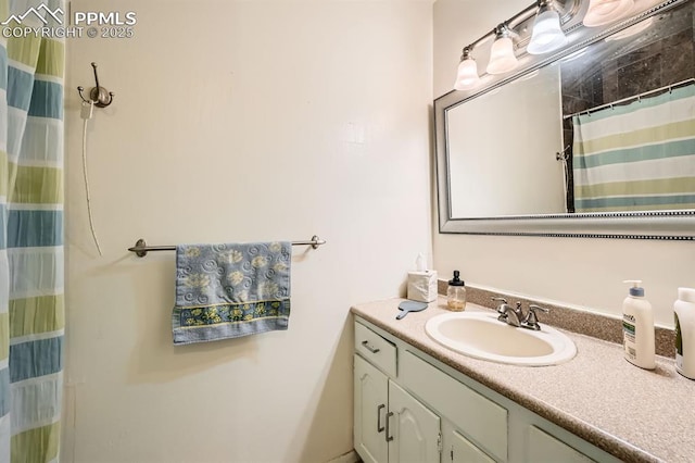 376 Gardenia Rd, Woodland Park, CO 80863 - bathroom with vanity and a shower with shower curtain