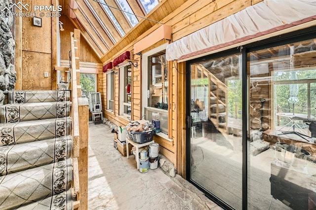 376 Gardenia Rd, Woodland Park, CO 80863 - miscellaneous room with wood walls and high vaulted ceiling