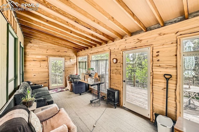 376 Gardenia Rd, Woodland Park, CO 80863 - sunroom featuring healthy amount of natural light and a wood stove