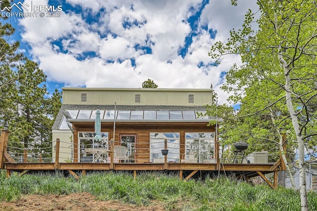 376 Gardenia Rd, Woodland Park, CO 80863 - back of property featuring a standing seam roof, a metal roof, and a deck