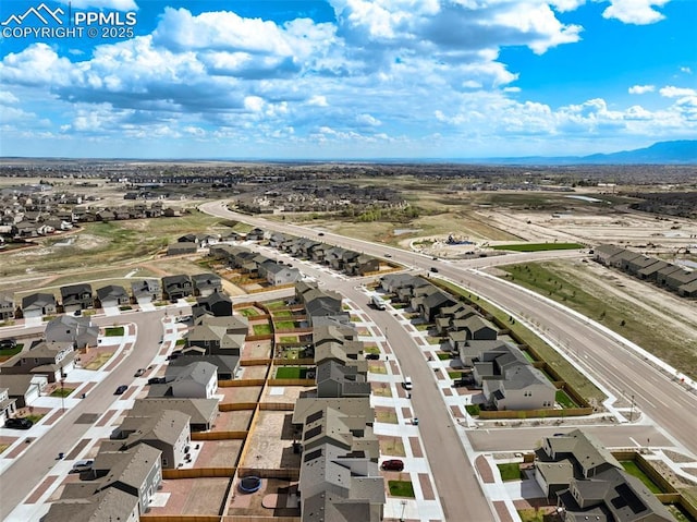 8101 Goldenray Pl, Colorado Springs, CO 80908 - aerial perspective of suburban area featuring a mountain backdrop and a major roadway