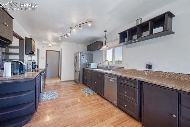 9503 Brisk Breeze Ct, Colorado Springs, CO 80925 - kitchen with stainless steel appliances, open shelves, light wood-type flooring, and decorative light fixtures
