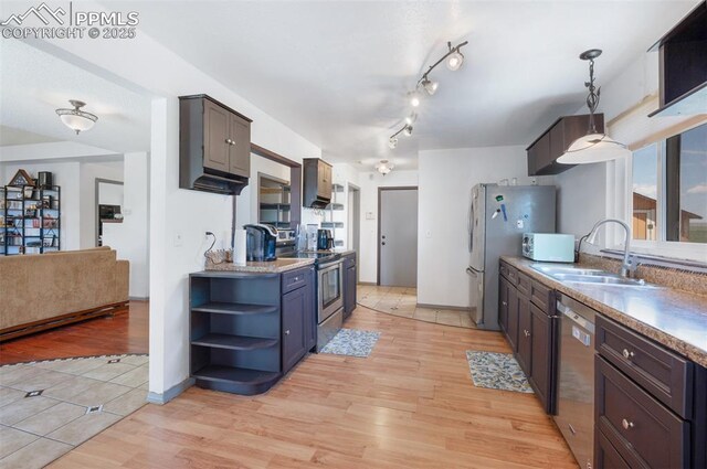 9503 Brisk Breeze Ct, Colorado Springs, CO 80925 - kitchen with appliances with stainless steel finishes, open shelves, and light wood finished floors