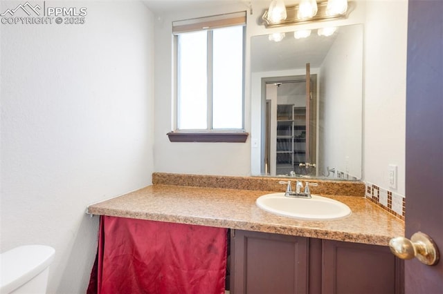 9503 Brisk Breeze Ct, Colorado Springs, CO 80925 - half bathroom with vanity and toilet