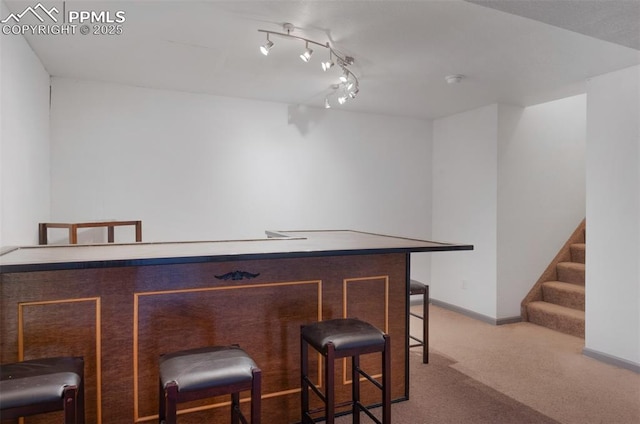 9503 Brisk Breeze Ct, Colorado Springs, CO 80925 - indoor dry bar featuring carpet floors and stairs