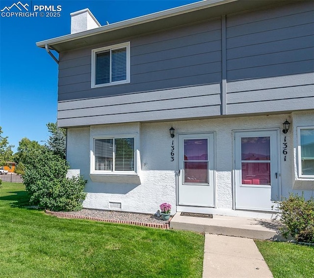 1363 Soaring Eagle Dr, Colorado Springs, CO 80915 - view of front of property featuring a front lawn and a chimney