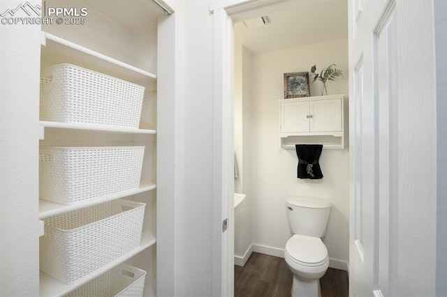 1363 Soaring Eagle Dr, Colorado Springs, CO 80915 - bathroom featuring wood finished floors and toilet