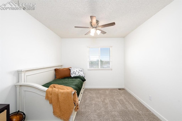 1363 Soaring Eagle Dr, Colorado Springs, CO 80915 - sitting room featuring ceiling fan, a textured ceiling, and carpet flooring