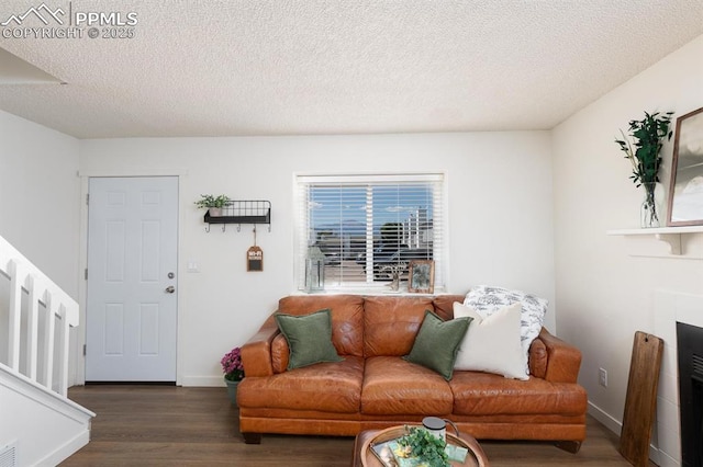 1363 Soaring Eagle Dr, Colorado Springs, CO 80915 - living room with wood finished floors, a textured ceiling, and stairway