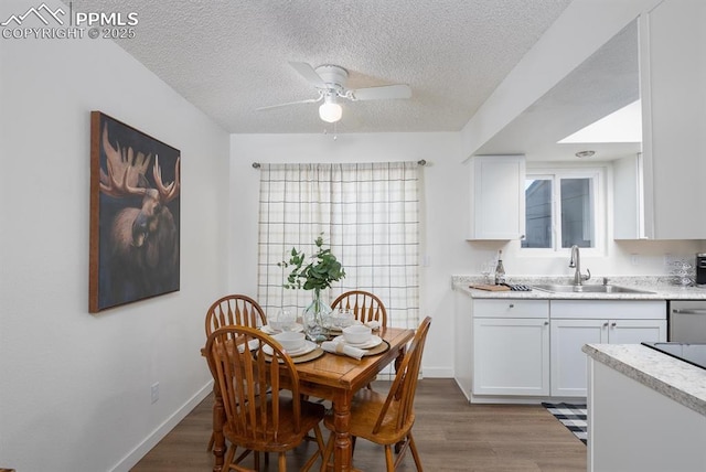 1363 Soaring Eagle Dr, Colorado Springs, CO 80915 - dining space featuring wood finished floors, ceiling fan, and a textured ceiling
