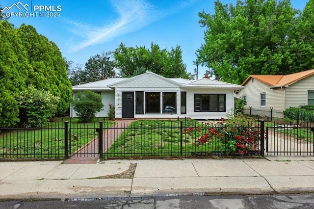 1314 Pioneer Rd, Colorado Springs, CO 80907 - bungalow-style home with a fenced front yard and a gate