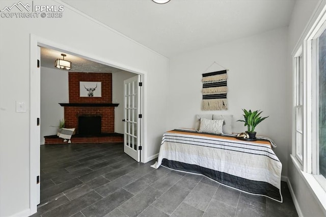 1314 Pioneer Rd, Colorado Springs, CO 80907 - bedroom featuring multiple windows and a fireplace